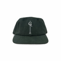 Green cap with white thread embroidery